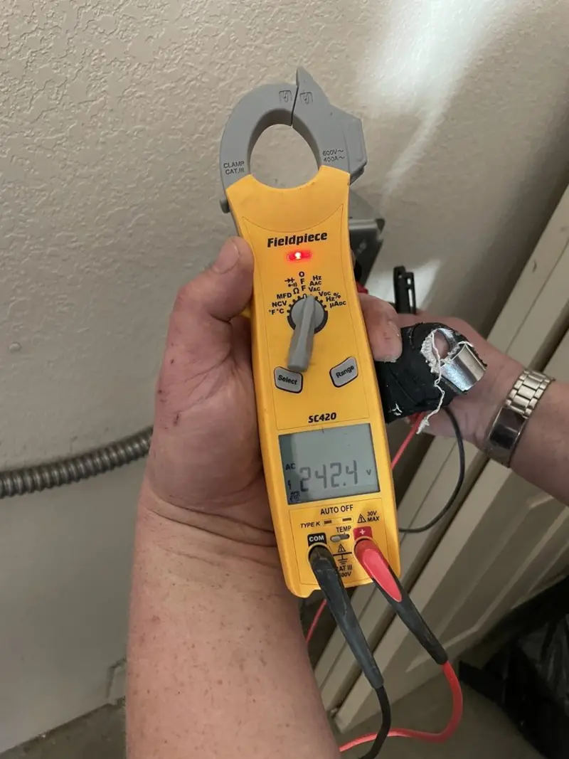 Voltage testing with clamp meter during Ceiling Fan Installation in Pamelia